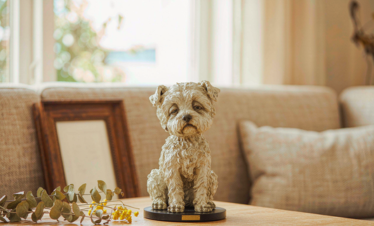 Hand-painted resin custom pet figurine on a wooden table in a warm home