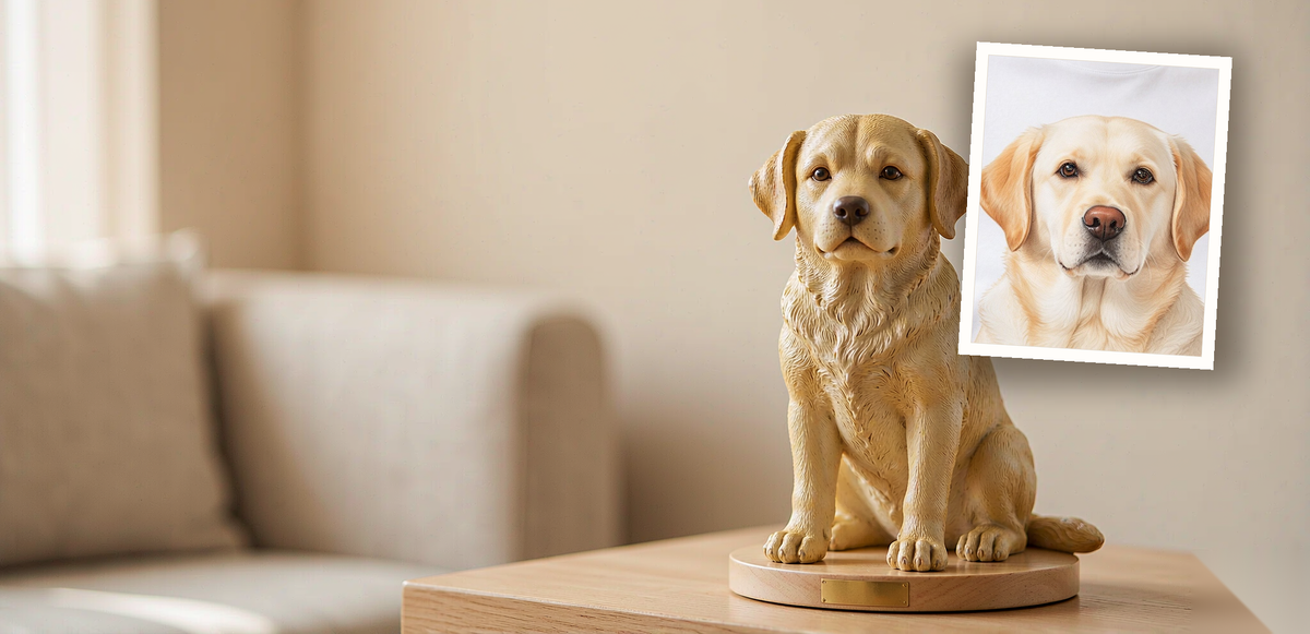 A printed photo of a cream Labrador Retriever pinned beside the matching hand-painted figurine — the photo the figurine was made from